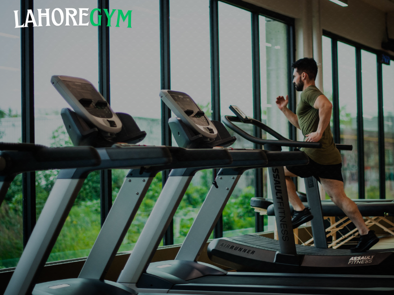 Person feeling stressed while sitting in a gym, symbolizing how mental pressure affects physical results.