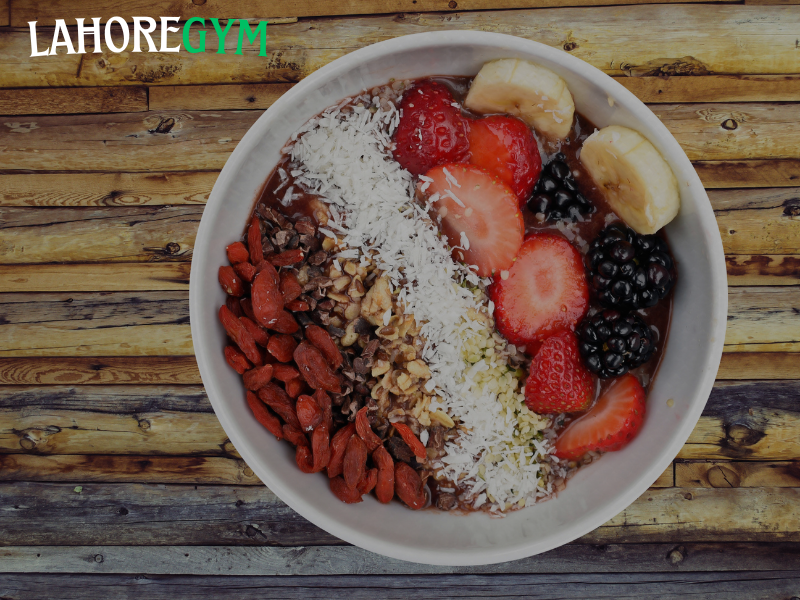 Healthy fat-burning foods like eggs, salmon, avocado, green tea, and oatmeal arranged on a kitchen counter – perfect for a Las Vegas-style clean diet