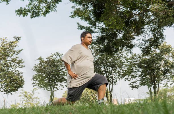 man performing his physical exercise routine in the outdoor park