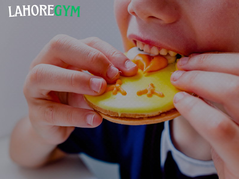 Post-workout sugar consumption – does it help or hurt? man eating banana after workout inside gym to recover energy