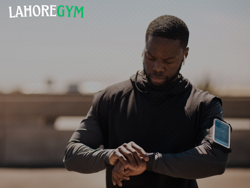 Man tracking workout progress on fitness app with data chart